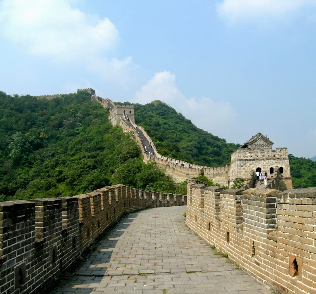 The Great Wall at Mutianyu climbing through forested ridges outside Beijing